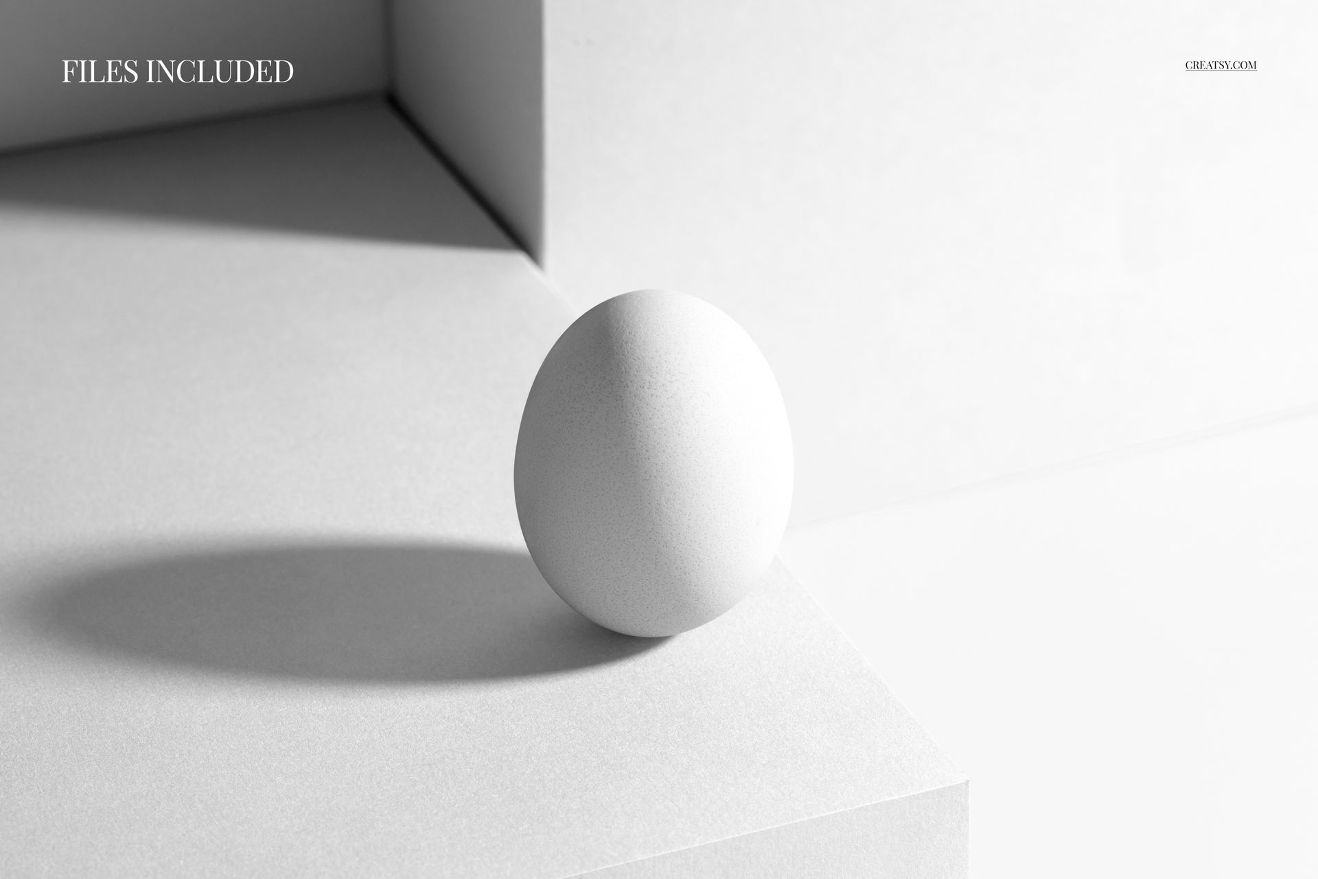 White Easter egg placed on a geometric pedestal with sharp angles, shown in a minimalistic front view mockup.