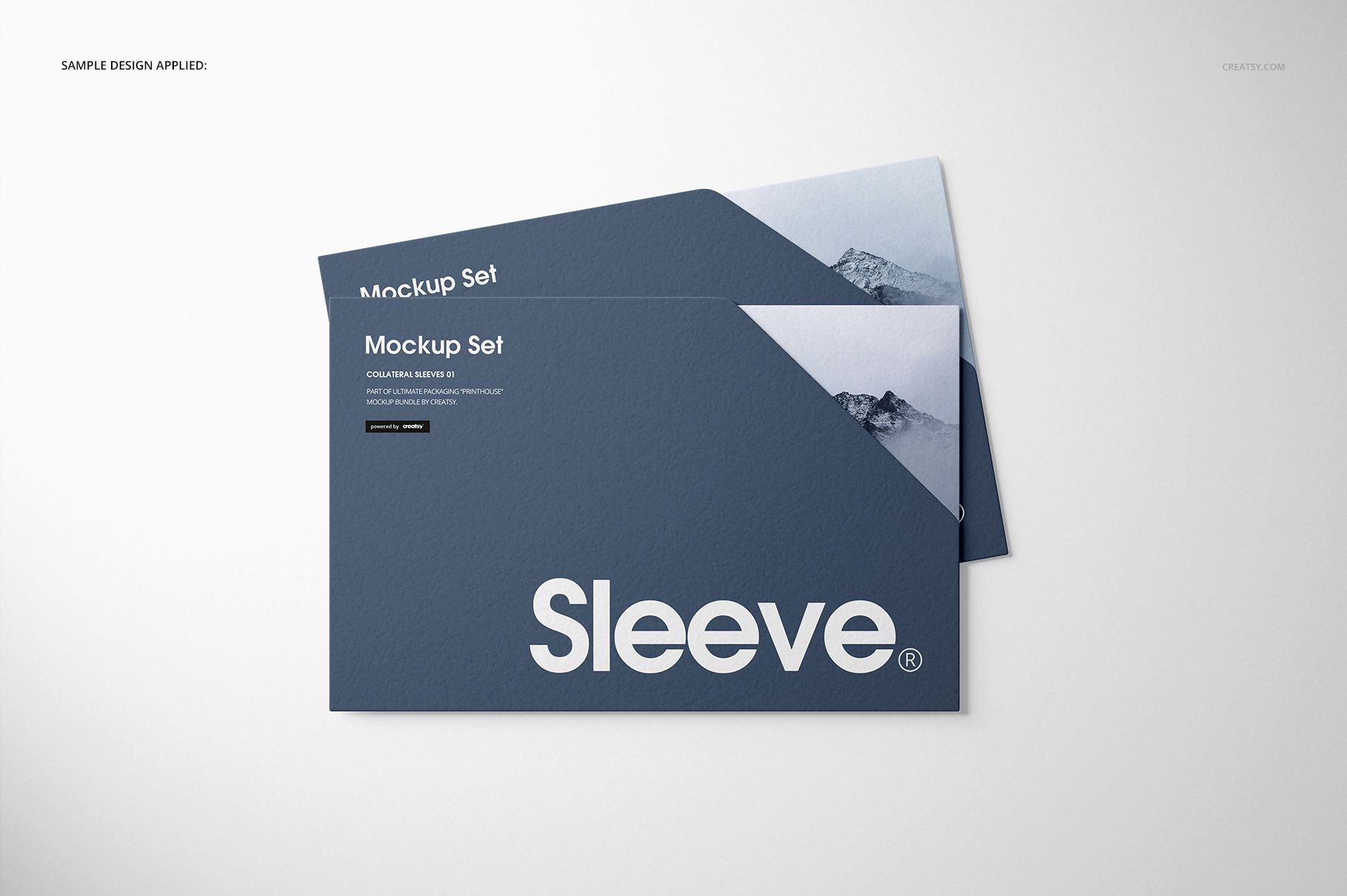 Stationery sleeves mockup set featuring two blue sleeves with white text and mountain graphic, shown from above.