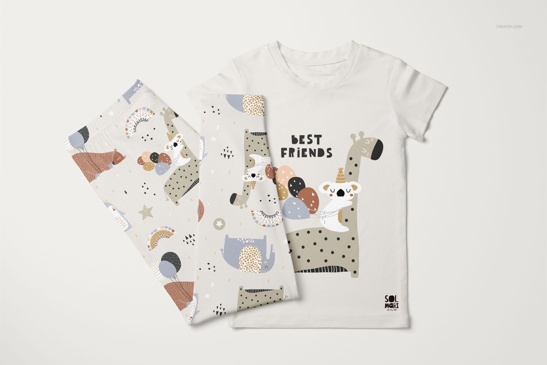 Kids short sleeve pajama set mockup with playful animal illustrations, shown from a top view on a white background.