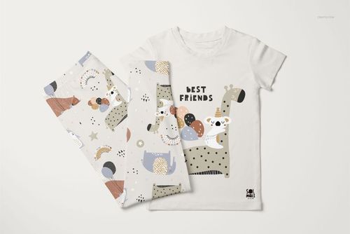 Kids short sleeve pajama set mockup with playful animal illustrations, shown from a top view on a white background.