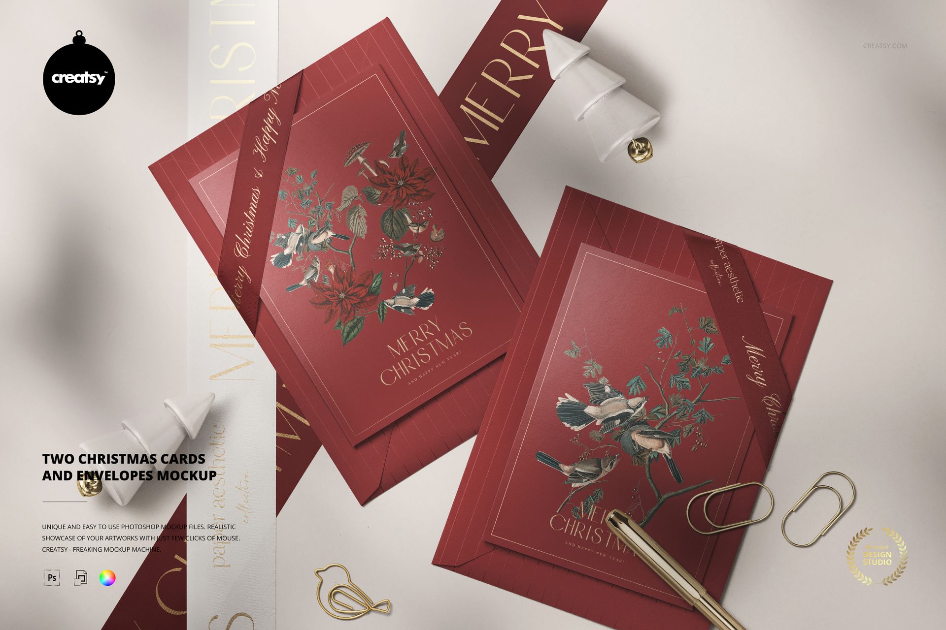 PSD mockup showing two decorative red Christmas cards and envelopes with gold accents, surrounded by stationery props.