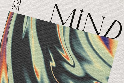 Close-up of an oversized hoodie mockup featuring a large hood, abstract swirl pattern, and bold typography.