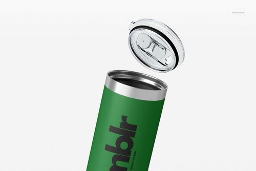 22oz skinny tumbler mockup in green with metallic rim, shown with transparent lid hovering above, isolated background.