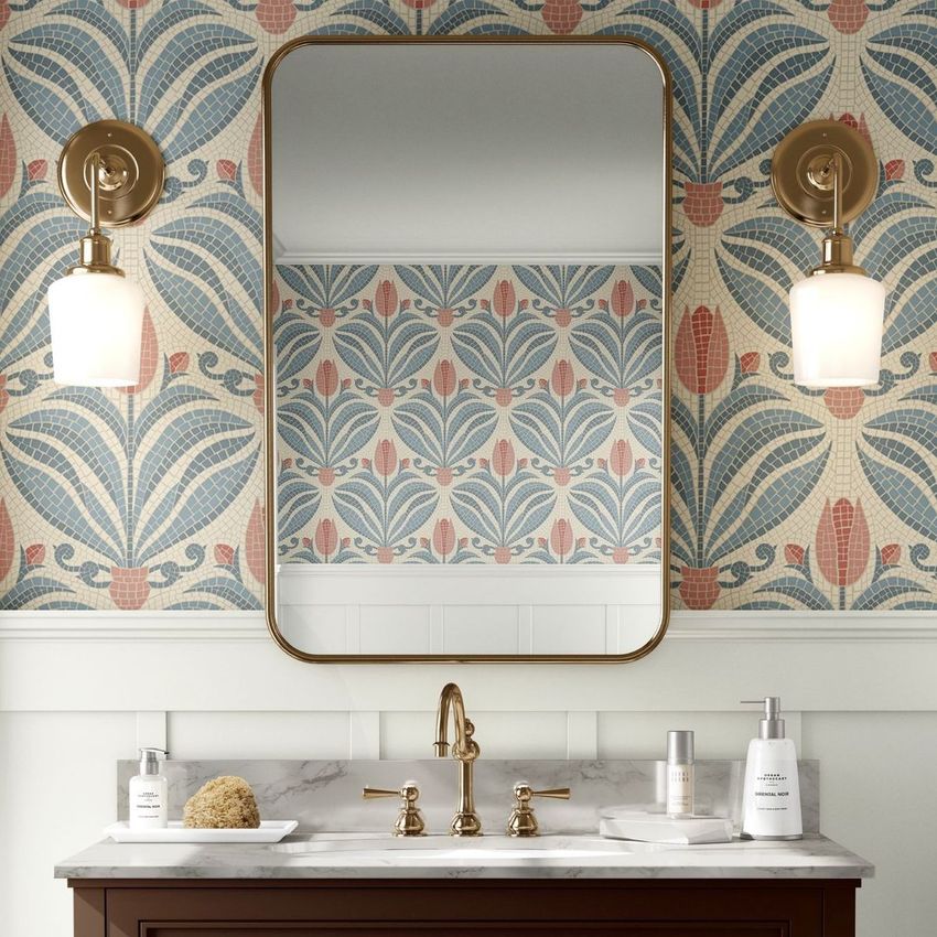 Bathroom mockup featuring a rectangular mirror above a marble countertop, with tulip mosaic wallpaper and brass sconces.