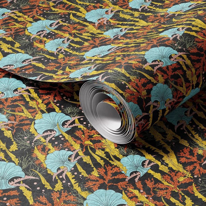 Paper wallpaper mockup showing a rolled sheet with a vibrant coral reef pattern in teal, orange, yellow, and black colors.