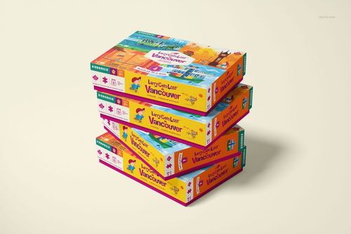 Puzzle game box PSD mockup set showing multiple boxes with illustrated covers, stacked diagonally on a neutral surface.