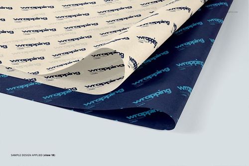 Two sheets of wrapping tissue paper mockup displayed on a flat surface, one cream and one navy, with repeating text pattern.