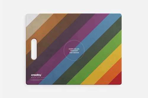 Top view of a colorful cutting board mockup featuring diagonal multicolored stripes and a handle on the left.