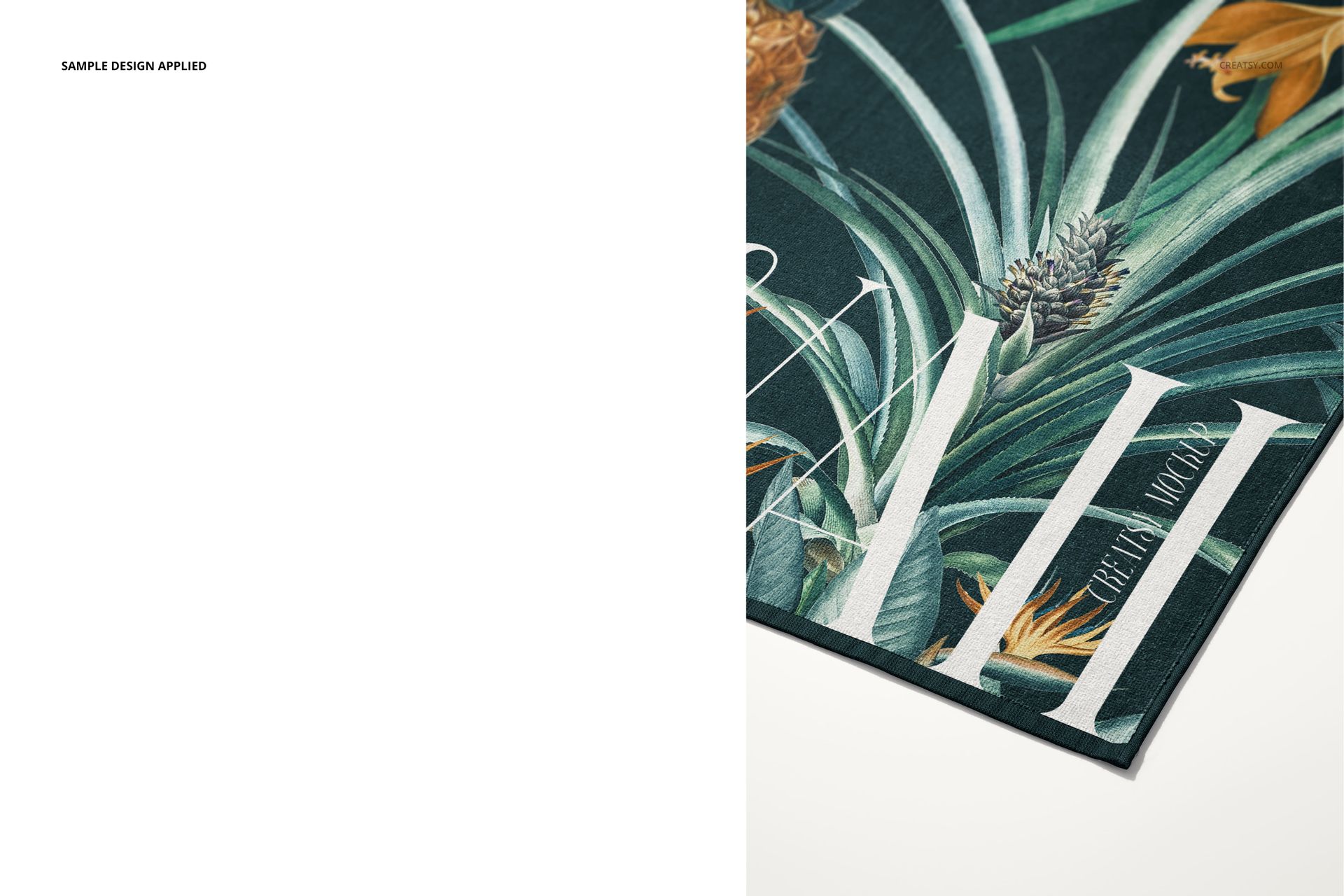 Detailed corner view of a beach towel mockup featuring a vibrant botanical print with green leaves and orange flowers.