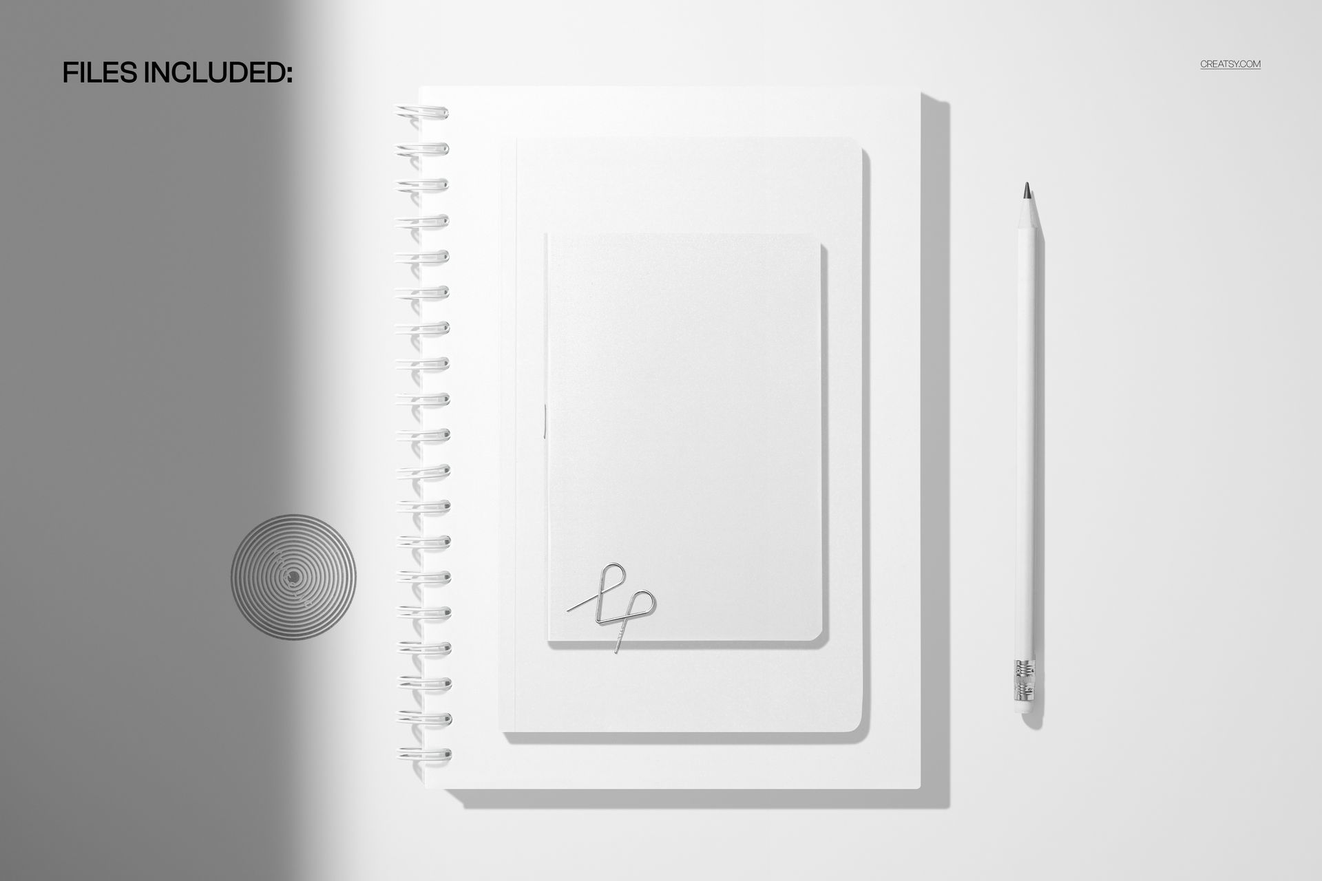Stationery mockup showing a spiral notebook, softcover notebook, and pencil from a top-down perspective on a clean surface.