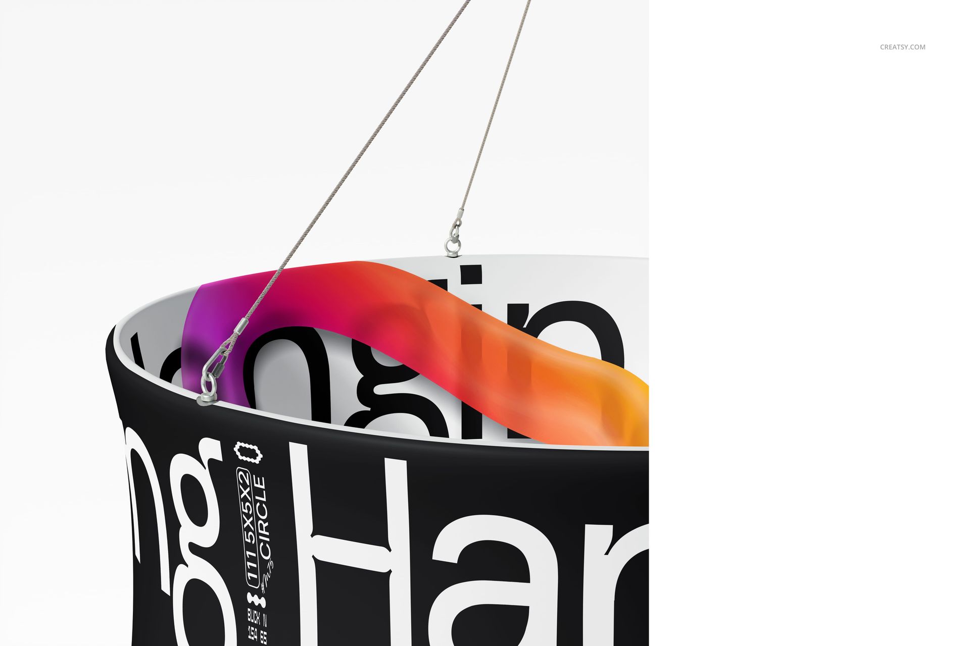 Circular display banner mockup showing black exterior with bold white lettering, suspended by metal cables.