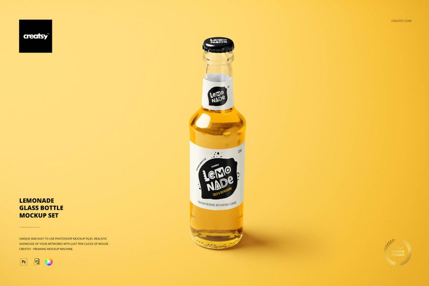 Lemonade glass bottle mockup with white and black label, standing upright against a solid yellow backdrop.
