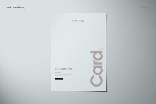 Flat card mockup displayed from a top view on a light gray surface, featuring minimal text and soft shadows.