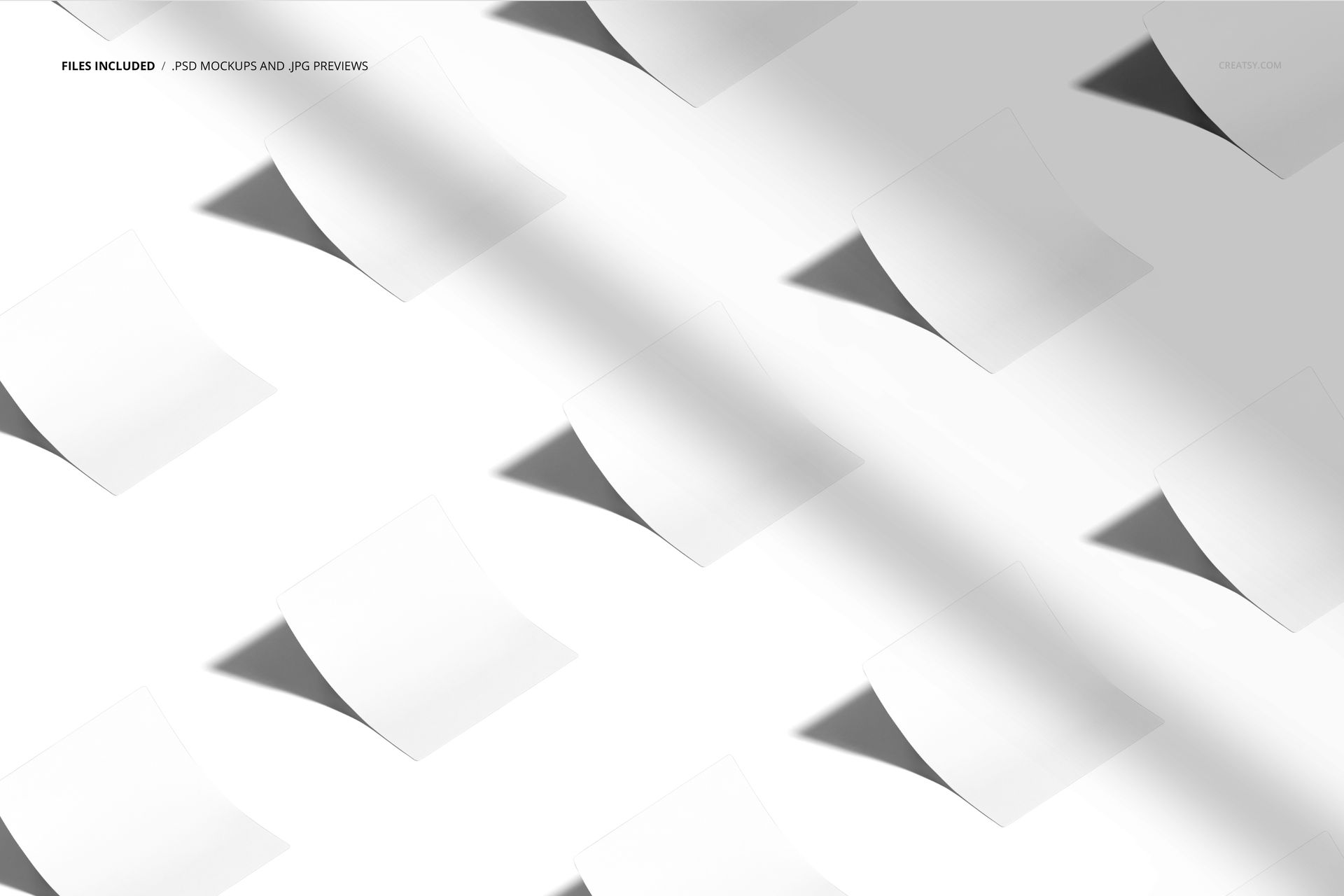 PSD mockup of square stickers scattered on a clean white surface, showing subtle shadows and a top-down perspective.