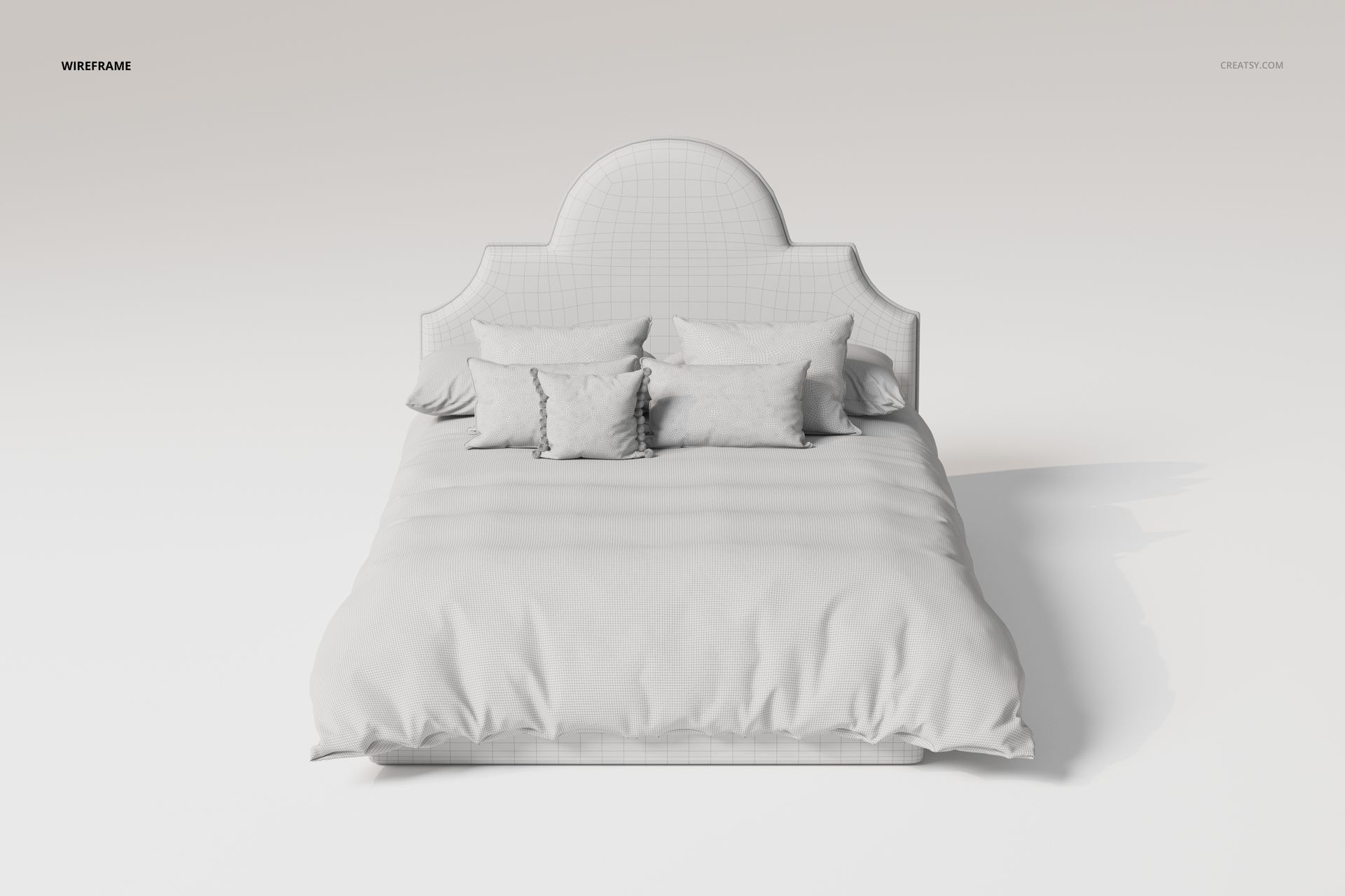 Front view of a bed with an upholstered arched headboard, multiple pillows, and a soft quilt in neutral tones.