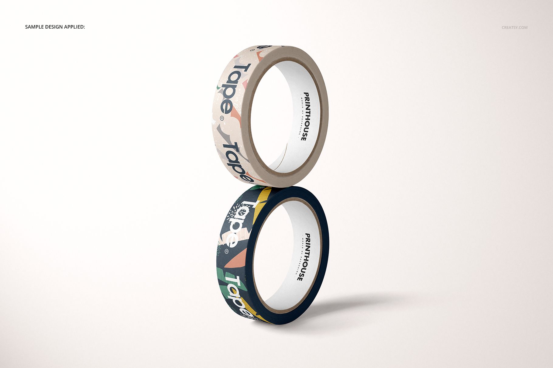 Front view of two decorative paper packing tape rolls, each with unique designs, presented as a PSD mockup.