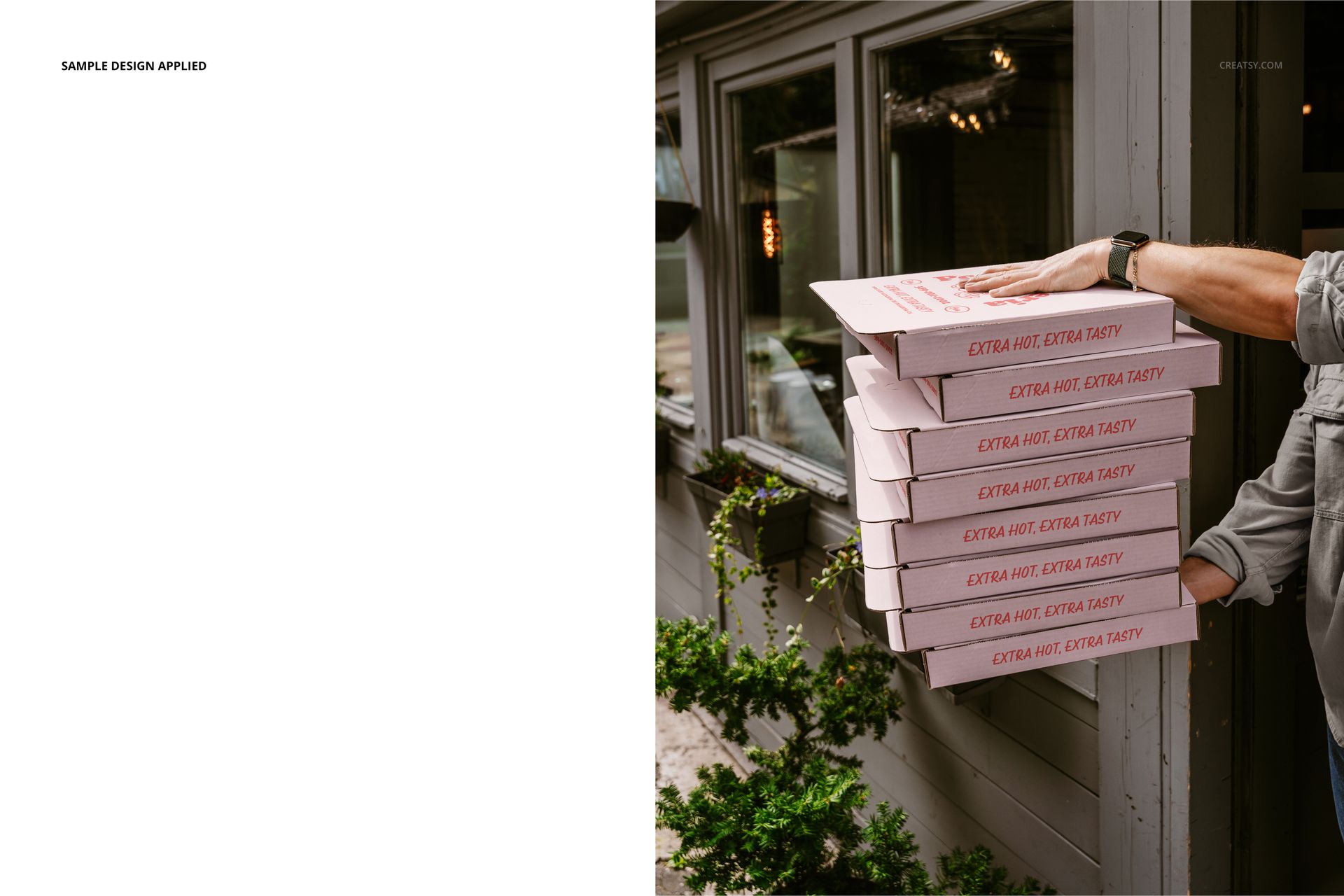 PSD mockup featuring a hand holding a stack of pink pizza boxes with red text, set outside by a window and greenery.