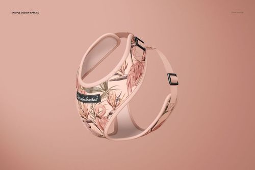 Front angled view of a dog harness mockup featuring a soft pink base with floral and leaf patterns on a plain background.