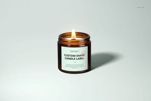 Single amber jar candle mockup with wooden wick, lit and placed on a plain background, front perspective.