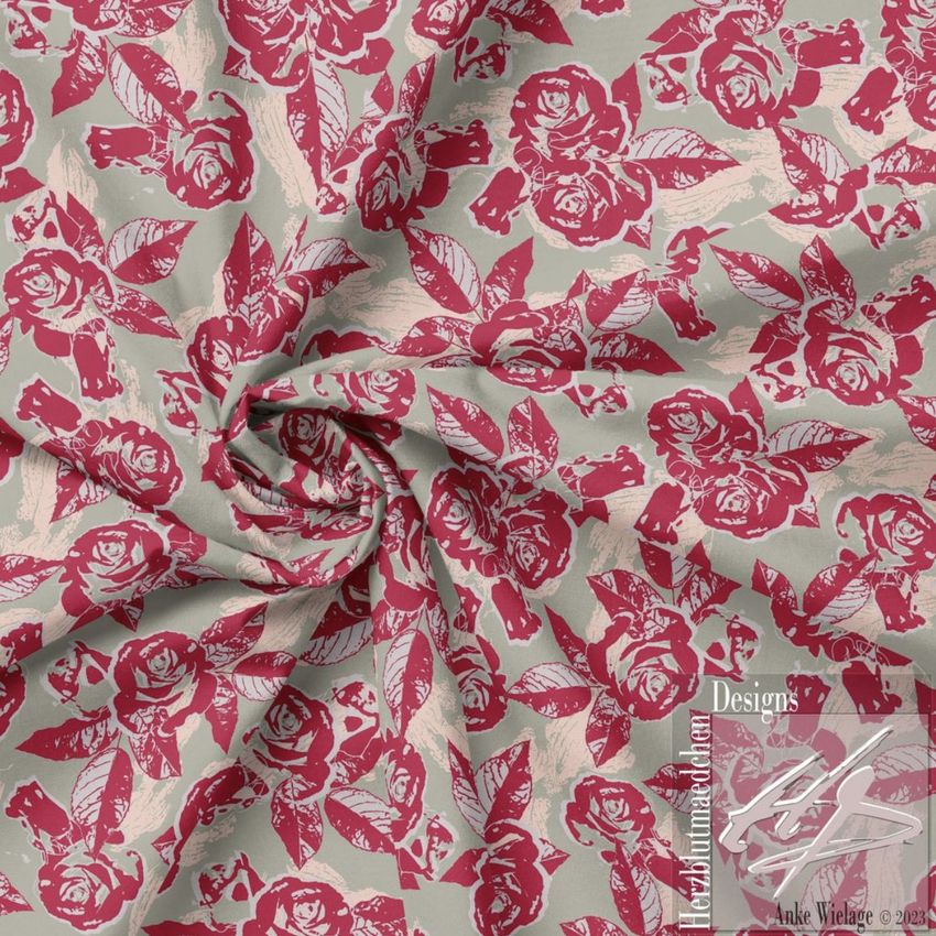 Creased fabric mockup featuring a pink and beige floral pattern with roses and leaves, viewed from above with a central swirl.
