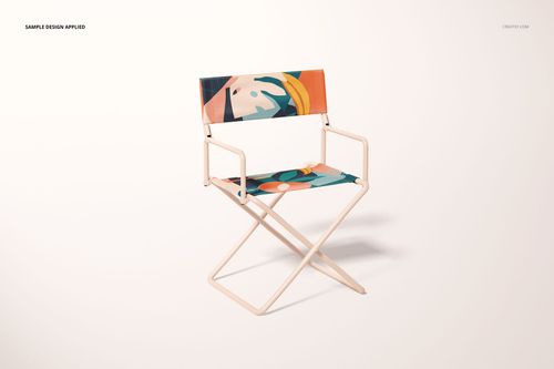 PSD mockup of a folding directors chair featuring a white metal frame and vibrant geometric design, isolated background.