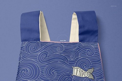 Front view of a baby romper mockup with blue shoulder straps and a wave pattern on a purple background.