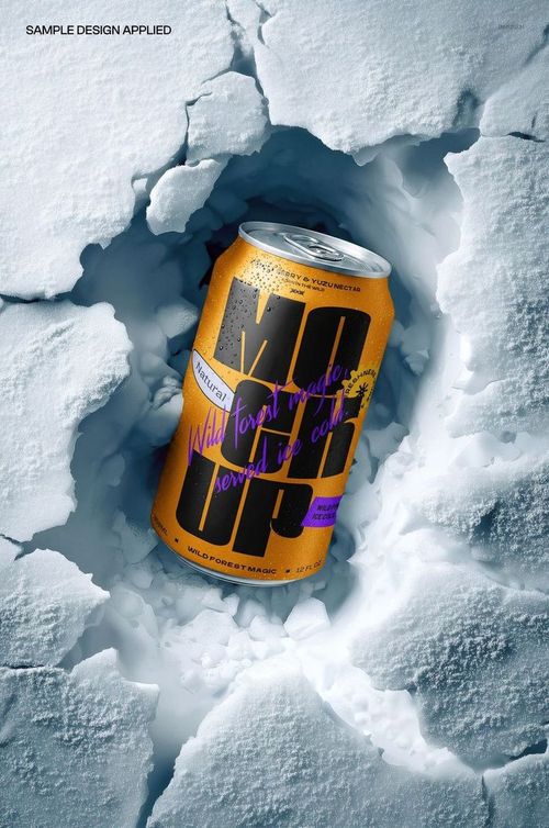 PSD mockup showing a drink can nestled in snow, with bold yellow and purple graphics on the can, top-down angle.