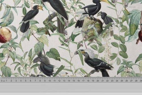 Fabric mockup featuring a botanical pattern with birds and green leaves, displayed with a ruler for scale reference.