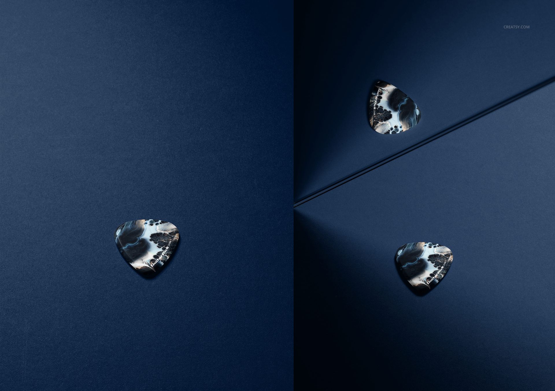 PSD mockup displaying a guitar pick with a bold pattern, positioned on a blue background with dramatic lighting and a mirror.