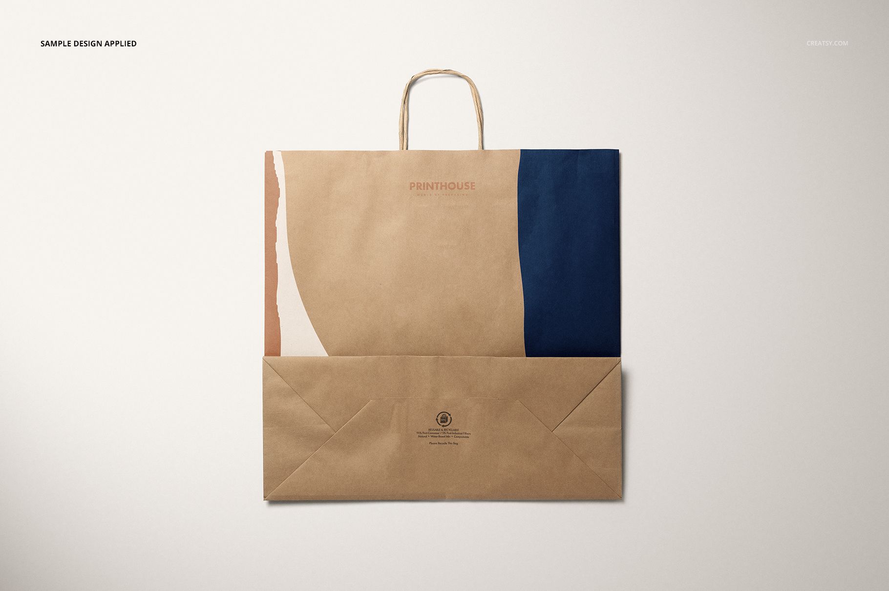 Kraft paper shopping bag mockup with a folded bottom, abstract design in beige, peach, and dark blue hues.