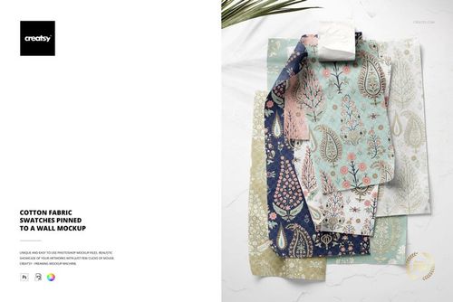 Front view of cotton fabric swatches with various floral and paisley patterns pinned to a white wall in a mockup scene.