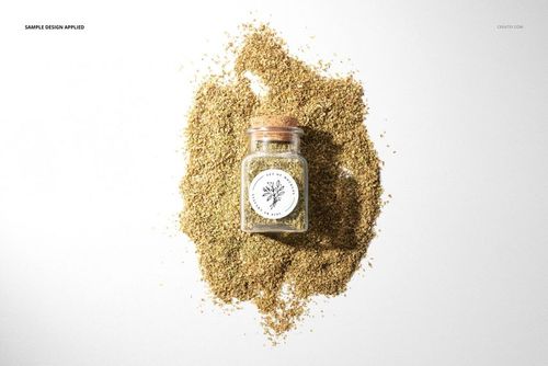 Mockup of a spice jar with a circular label and wooden lid, surrounded by loose seasoning, photographed overhead.