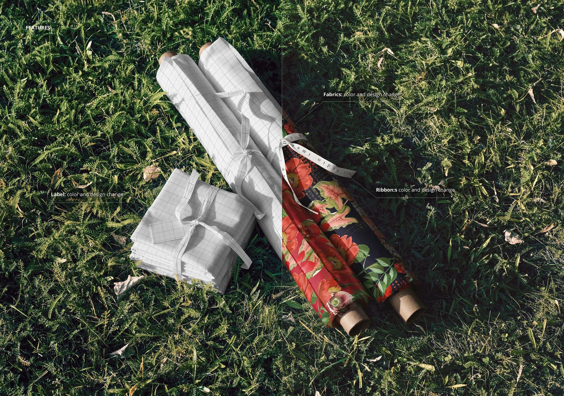 Fabric rolls and folded stacks with grid and floral patterns arranged on green grass, viewed from above.