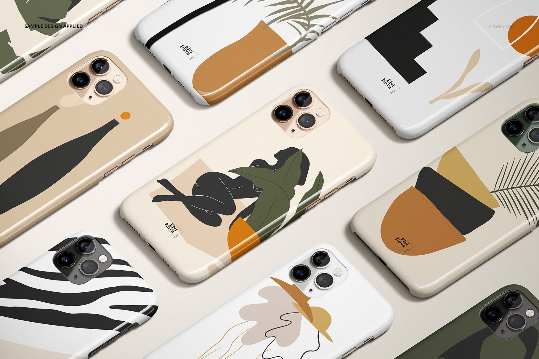 PSD mockup of iPhone 11 Pro cases displayed flat, showcasing various artistic prints and neutral color palettes.