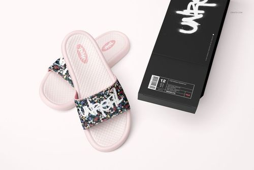 Slide sandals mockup featuring pastel pink soles, textured footbeds, and graffiti-style straps, placed beside a black box.