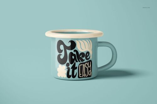 Light blue enamel mug with cream rim, featuring bold black and cream decorative text, shown in front view on a solid pastel background.