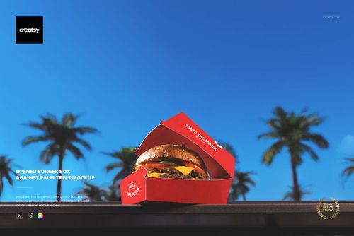 Red burger box mockup featuring a cheeseburger, shown from a front angle with palm trees and sky in the background.
