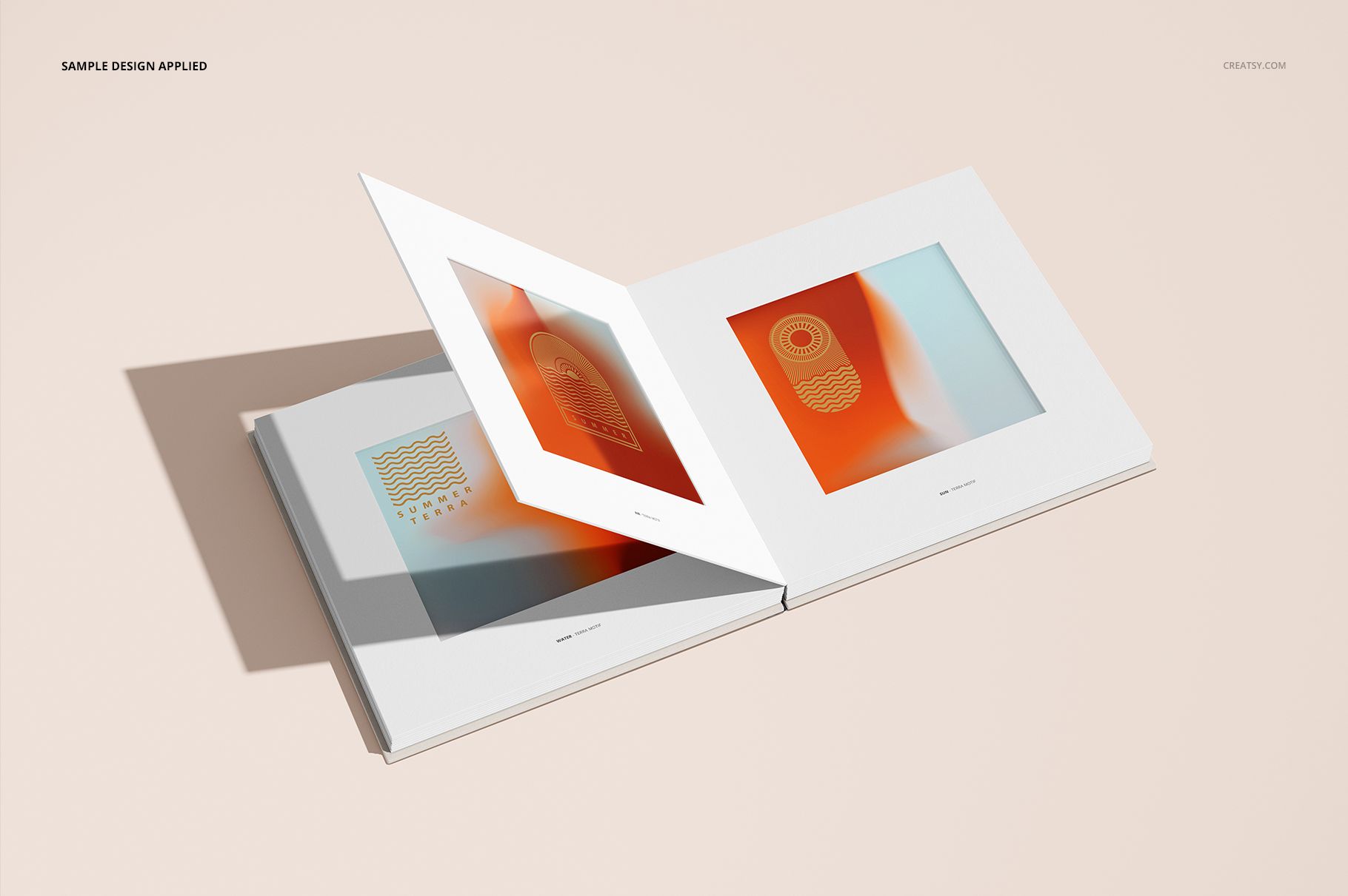 Open artbook mockup with two white hardcover pages displayed, featuring abstract orange and beige artwork.
