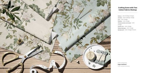 Top view of cotton fabric mockup with botanical designs, scissors, measuring tape, and sewing accessories on wood background.