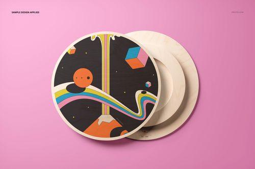 Round plywood wall art mockup with colorful abstract design on a pink background, shown from a front angle.