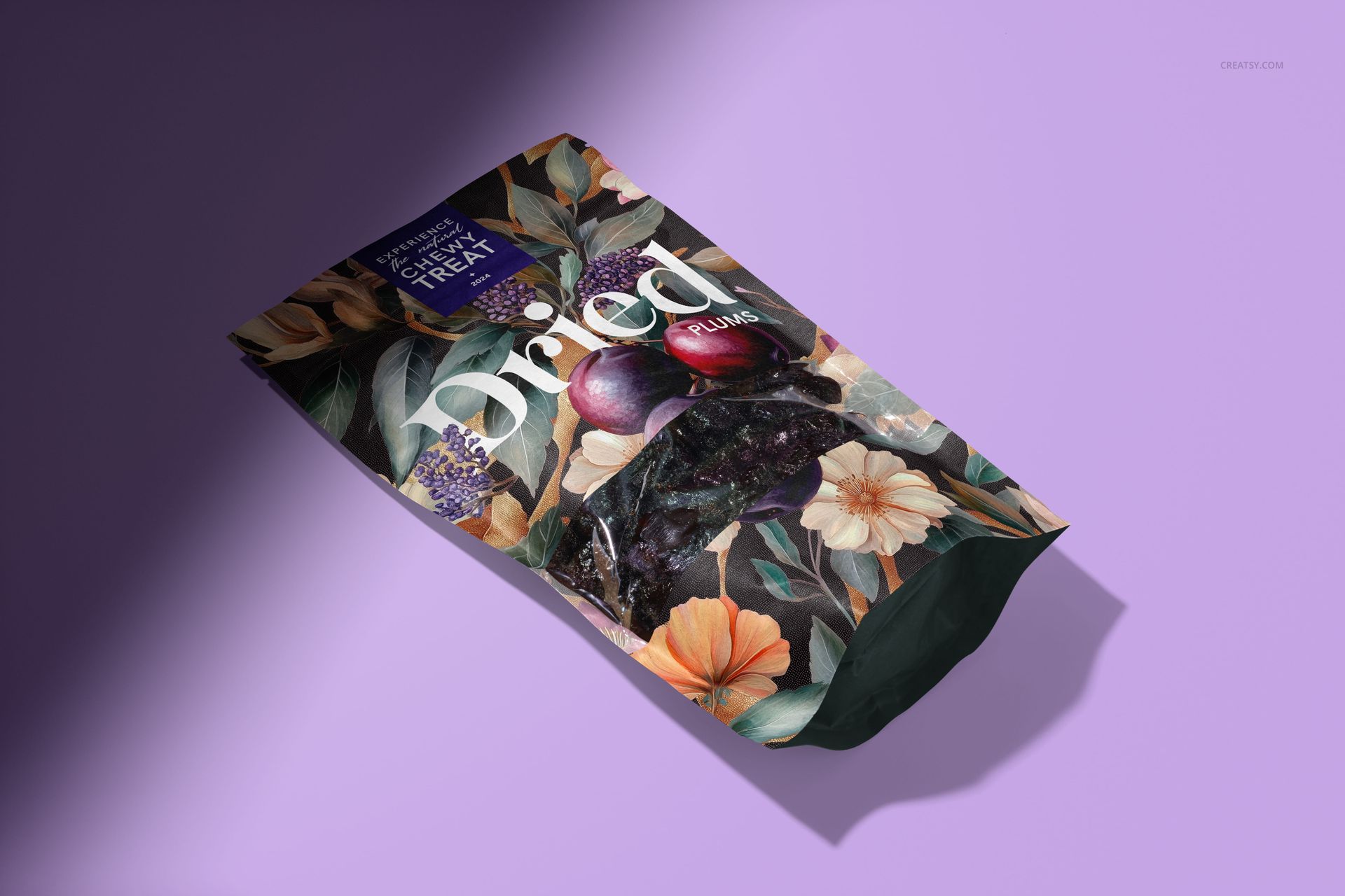 Front view of a floral paper pouch mockup featuring dried plums imagery and botanical illustrations on a purple surface.