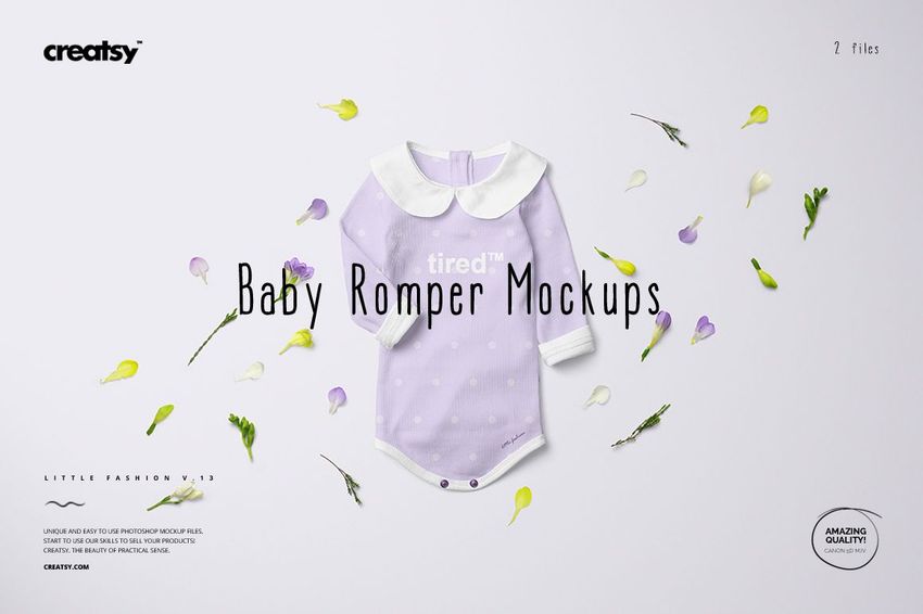 PSD mockup showing a baby romper in pastel purple with white trim, arranged with assorted petals on a neutral surface.
