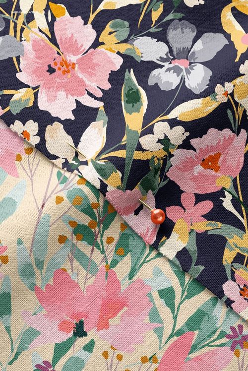 Detailed close-up of cotton fabric mockup featuring layered floral prints in pink, green, and navy tones with a pin.