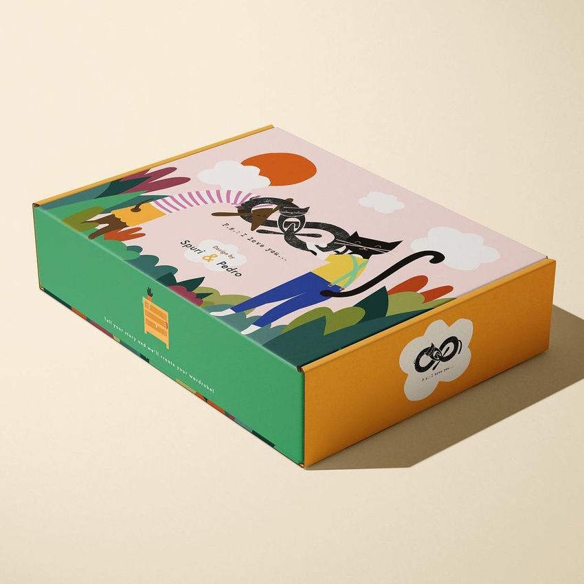 Mailing box mockup featuring a colorful illustrated design with abstract shapes, a cat graphic, and text on the lid.