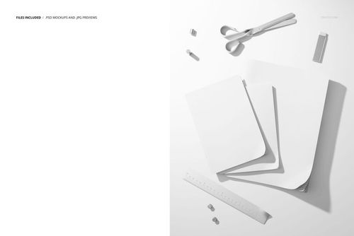 Flat lay scene featuring three plain notebooks, a ruler, binder clips, and spoons on a white background for PSD mockup.