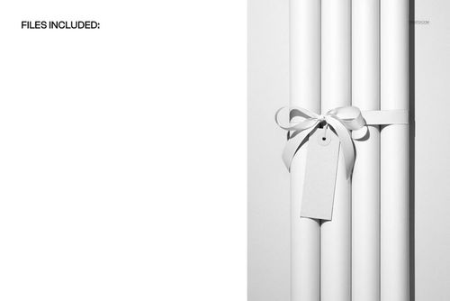 PSD mockup showing four plain wrapping paper rolls grouped vertically, decorated with ribbon and a hanging label.