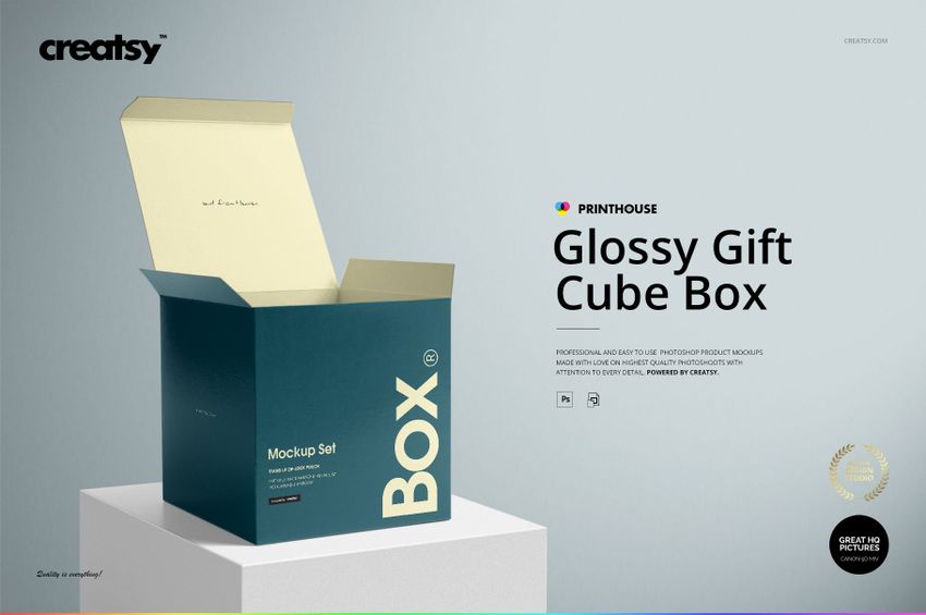 Glossy square gift box mockup with an open lid, teal exterior and light yellow interior, shown at an angle.