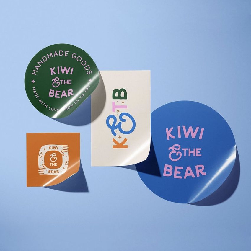 Sticker mockup featuring four colorful stickers with playful designs and text, arranged on a light blue background.