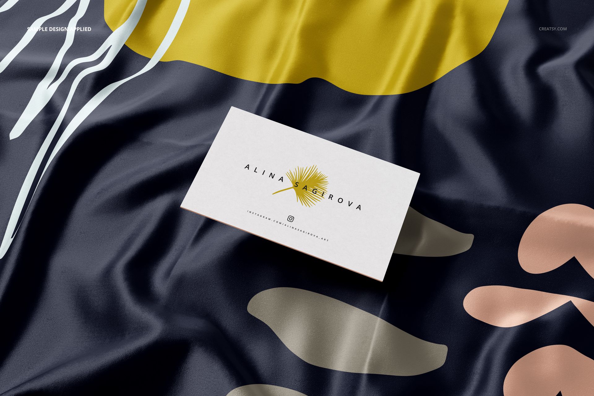 Square silk scarf mockup with narrow hem, featuring abstract yellow, beige, and white shapes on a dark background.