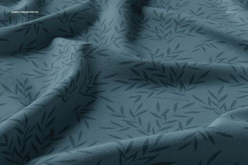 Double brushed polyester fabric mockup featuring a dark blue leafy pattern, shown in a close-up angled view.